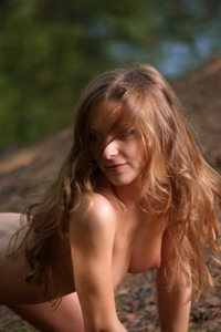 Young Masha posing naked in the forest