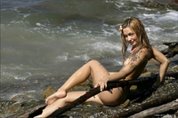 Cute teen Lilya naked along the shore