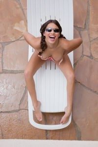 Nina loves sunbathing naked