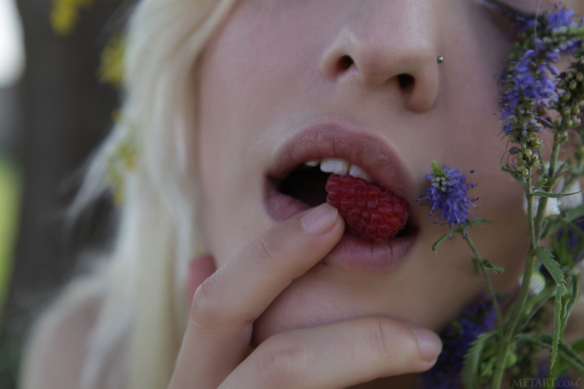  she devours a succulent raspberry between her luscious lips
