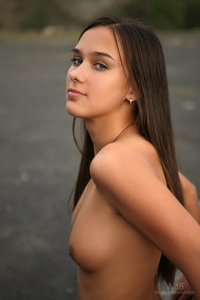 Sweet teen Victoria naked on the rock