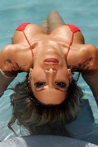 Hot brunette babe Kayla Carrera red bikini