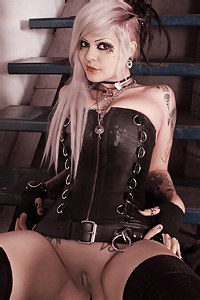Tattooed Girl In Leather Corset
